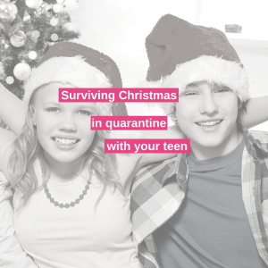 a sister and brother sit beside each other at christmas wearing santa hats